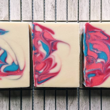 Brightly swirled soap, which is white with pink, blue, and brighter pink.