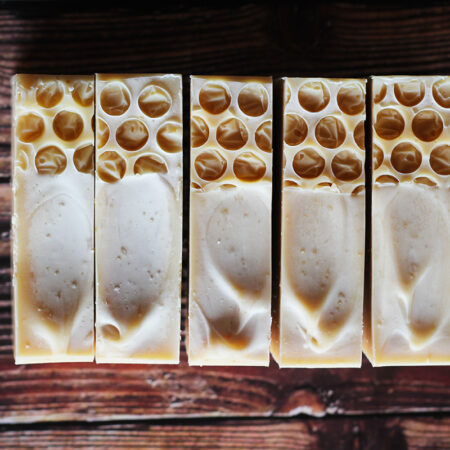 Top down photo of creamy looking soaps, with some honeycomb patterning on the surface, made with bubblewrap.